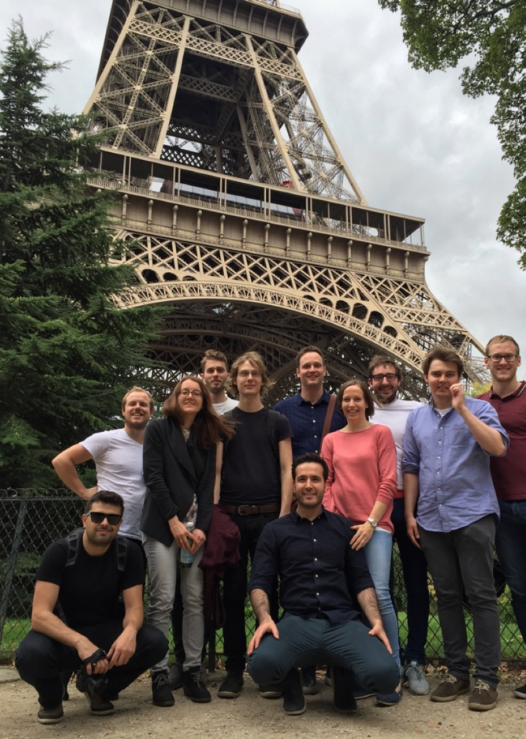 A Group of researchers in fromt of the Eiffel Tower in Paris